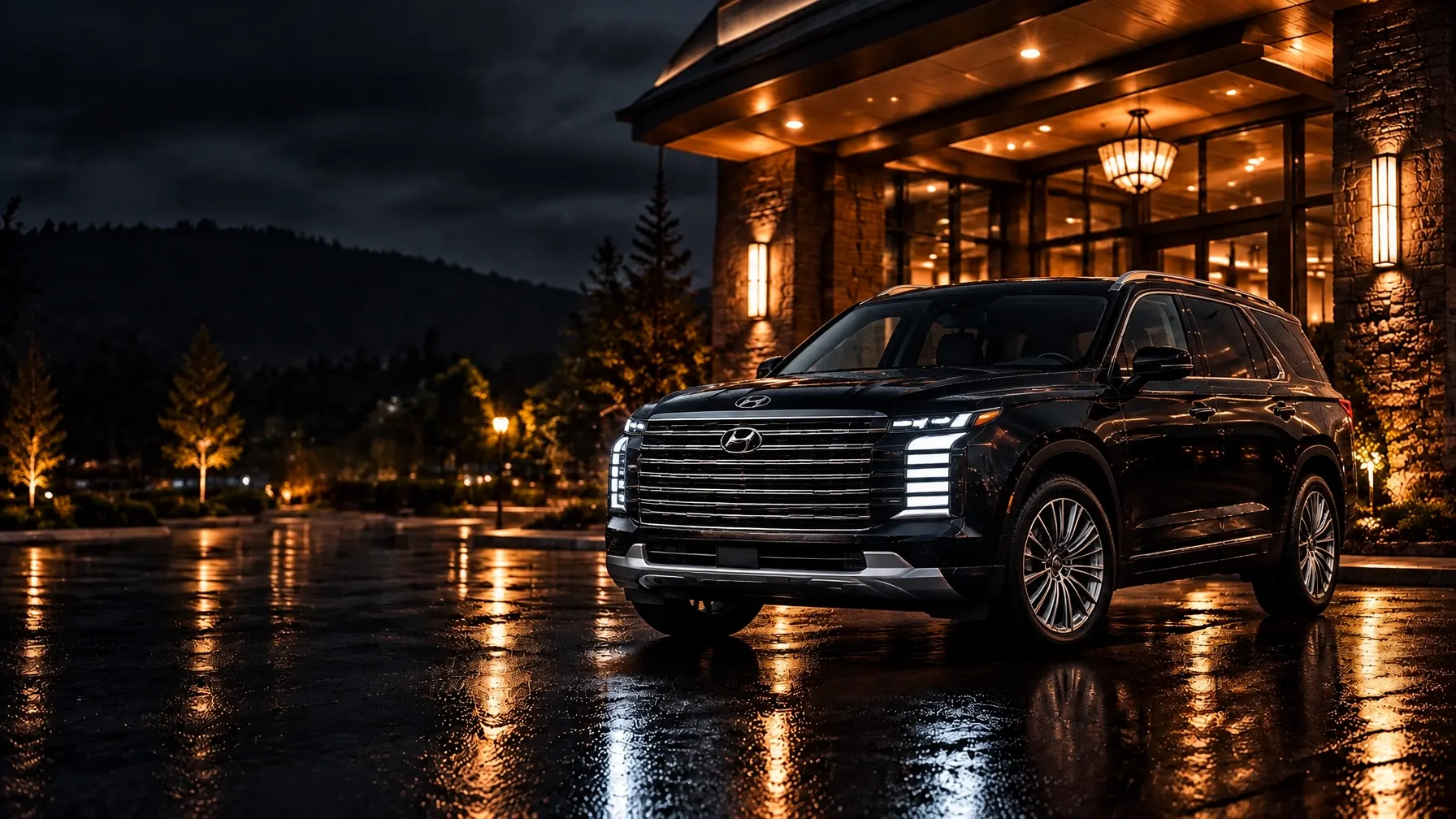 2026 black Hyundai Palisade outside a warmly lit hotel at night